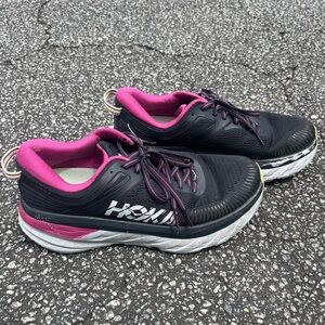 pink and black hokas
